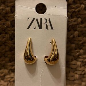 Gold Zara earrings.